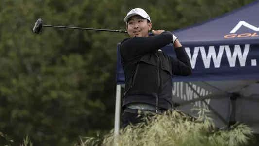 Jason Tang completes a golf swing