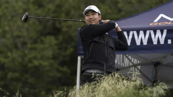 Jason Tang completes a golf swing