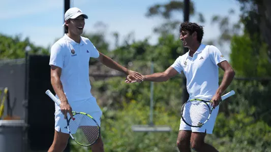 High five between Max Fardanesh and Rohan Sachdev