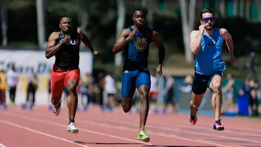 Three sprinters running the 100-meter