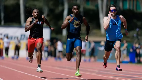 Three sprinters running the 100-meter