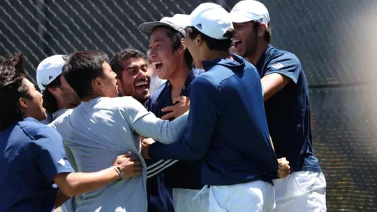 Hiroki Sakagawa in center of team celebration