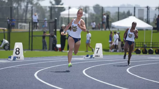 Esmeray Demirbas running on the track at Anteater Stadium