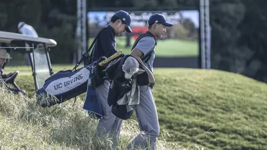 Two UC Irvine men's golfers walking the course