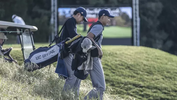 Two UC Irvine men's golfers walking the course