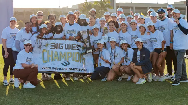 UC Irvine UC Irvine women's track and field poses with the trophy and Big West Championship banner