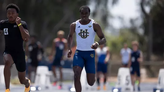 Justin Johnson mid-stride in the 100-meter dash