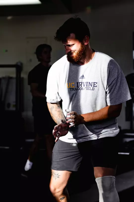 Jake Troxell smiling in between reps in the weight room