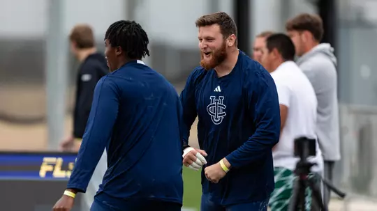 Jake Troxell interacting with teammate
