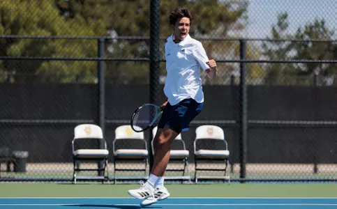 Alex Guajardo celebrates winning a point in a doubles match