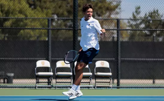 Alex Guajardo celebrates winning a point in a doubles match