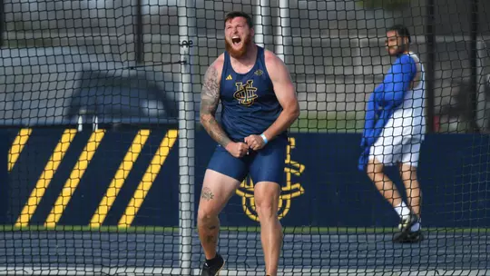 Jake Troxell flexes in the discus ring