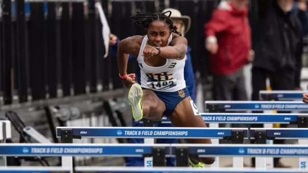 Jazzmine Davis clears a hurdle in a 100H NCAA First Round race