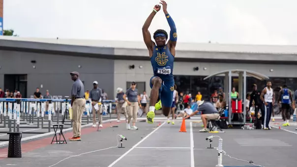 Kenechukwu Okonkwo in mid-air during a triple jump attempt