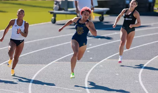 Joy Anderson sprinting the turn of the 200
