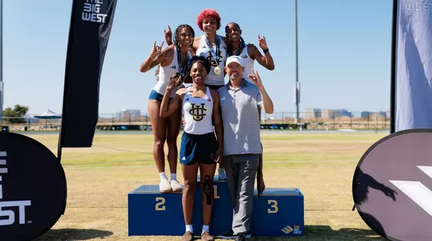 Heptathletes Jolie Robinson, Joy Anderson, Jazzmine Davis, Zharia Taylor and coach Jeff Perkins pose for a photo on the podium at the Big West Championships