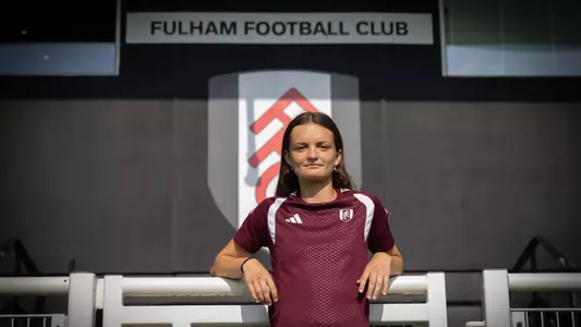 Women's soccer alum Sophie Gillies poses following her signing with Fulham FC