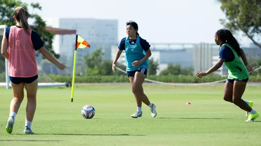 Chifumi Sasaki playing in training alongside Clara Samson and Cam LawsonKitchen in 2026