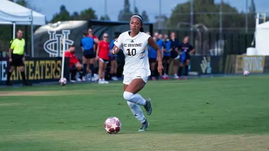 Fiona Shin drives upfield in a 2026 match vs. Utah Tech