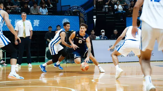 Tama Isaac dribbles through the Chinese Taipei defense during a win in New Taipei City at the 2026 William Jones Cup