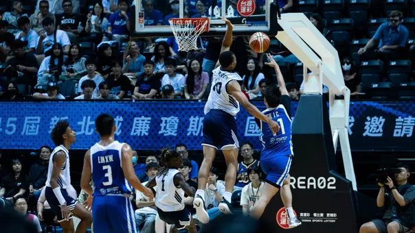 Josiah Johnson goes up for a block vs. Chinese Taipei White in the 2026 William Jones Cup