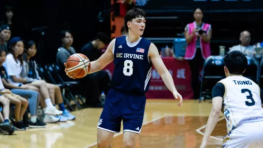 Luke Isaak takes the ball upcourt in a matchup vs. Malaysia in the 2026 William Jones Cup