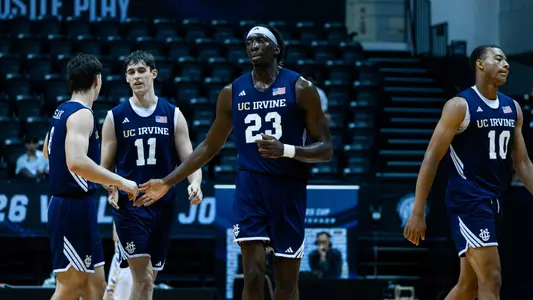 Nes Emeneke celebrates a play with Parker Spees, Josiah Johnson, and more Anteaters in a 2026 William Jones Cup game vs. Malaysia