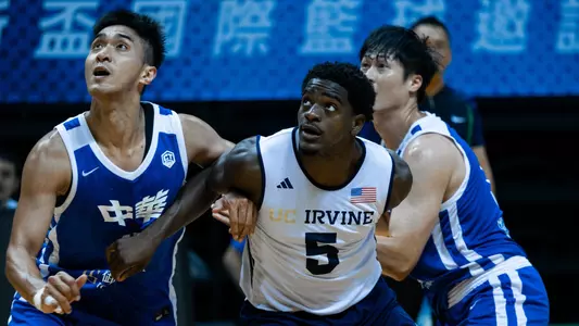 Ben Egbo defends against Chinese Taipei in a 2026 William Jones Cup matchup