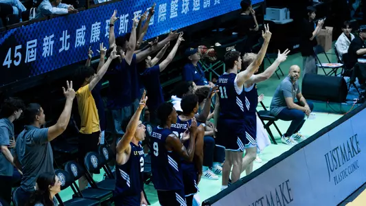 The bench erupts after a made basket in a William Jones Cup matchup