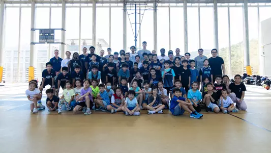 The 2026-2027 UCI men's basketball team poses with kids from a clinic put on in Taiwan during the Jones Cup
