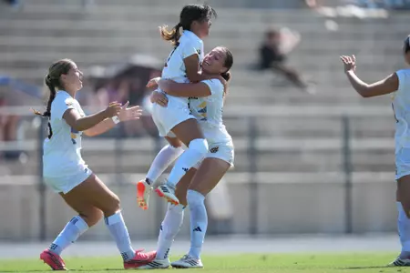 Chifumi Sasaki jumps into the arms of Taylor Esparza to celebrate her equalizing goal in a 2026 match vs. Grand Canyon