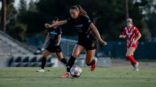 Samara Maldonado dribbles upfield in an exhibition match vs. Arizona