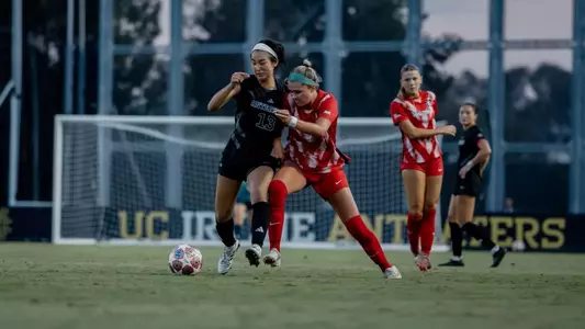 Mimi Yamamoto battles with an Arizona defender in an exhibition match to open 2026