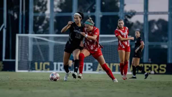 Mimi Yamamoto battles with an Arizona defender in an exhibition match to open 2026