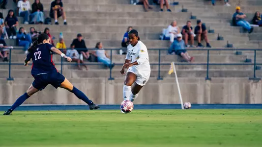 Mimi Dominguez dribbles around a Utah Tech player in a 2026 match in Anteater Stadium