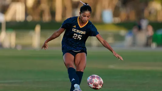 Jasmyne Wheeler kicks a ball ahead in a 2026 match vs. San Diego