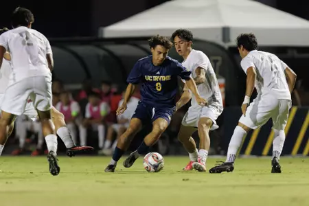 Isaiahs Gutierrez carves through a slew of UNLV defenders in a 2026 match at Anteater Stadium