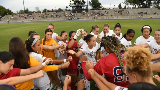 Women's soccer huddles up before their 2026 match vs. Cal State Bakersfield in Anteater Stadium