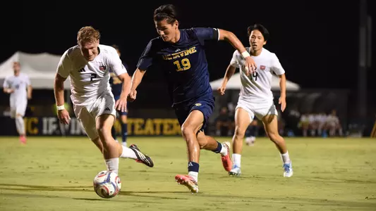 Brady Treinen drives upfield in a 2026 match in Anteater Stadium vs. Missouri State
