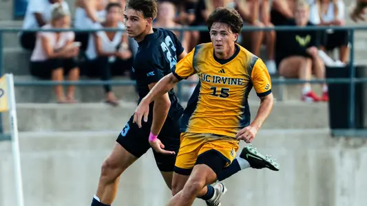 Cade Williams drives by a San Diego defender in a 2026 match in Anteater Stadium
