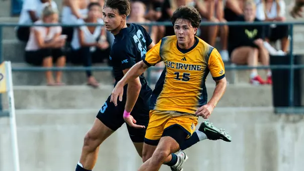 Cade Williams drives by a San Diego defender in a 2026 match in Anteater Stadium