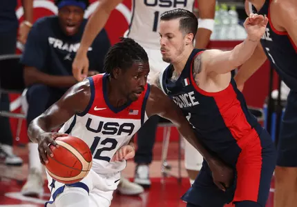 Jrue Holiday drives to the basket against Thomas Heurtel of France. (Photo by Ezra Shaw/Getty Images)
