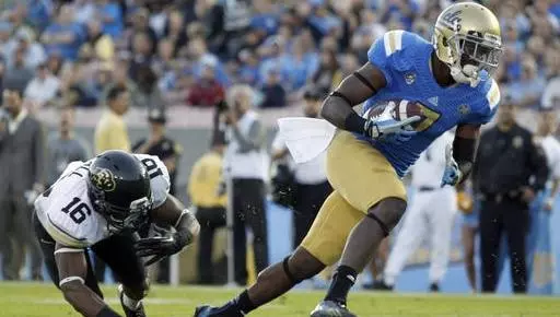 UCLA wide receiver Devin Fuller, right,