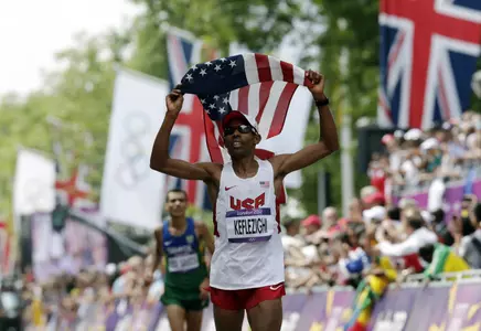 United States' Mebrahtom Keflezighi crosses the finish line in the men's maratho