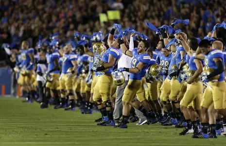 Members of the UCLA team cheer after a moment of silence