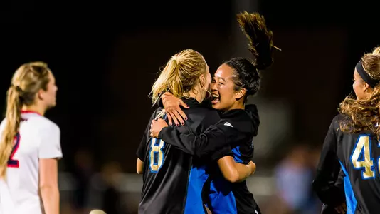 Abby Dahlkemper and Caprice Dydasco celebrate (photo by Scott Chandler)