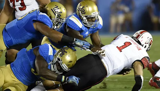 UCLA defense sacks Utah quarterback Kendal Thompson (photo courtesy Getty Images