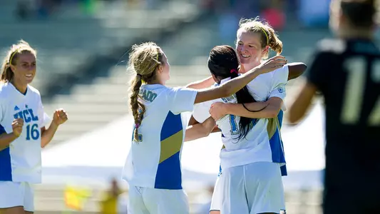 Sam Mewis receives congratulations (photo by Scott Chandler)