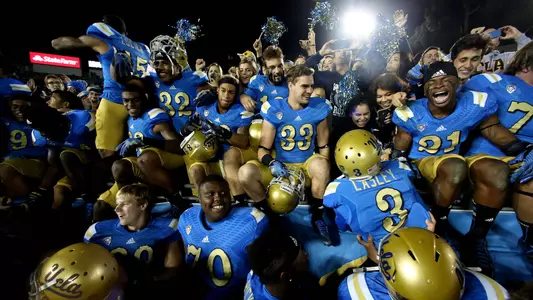 UCLA celebrates its 38-20 win over USC (photo courtesy Getty Images)