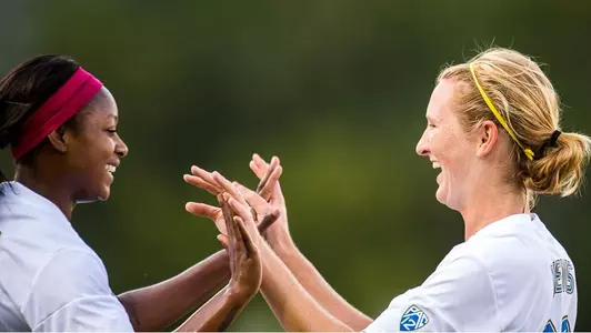 Taylor Smith and Sam Mewis celebrate (photo by Scott Chandler)